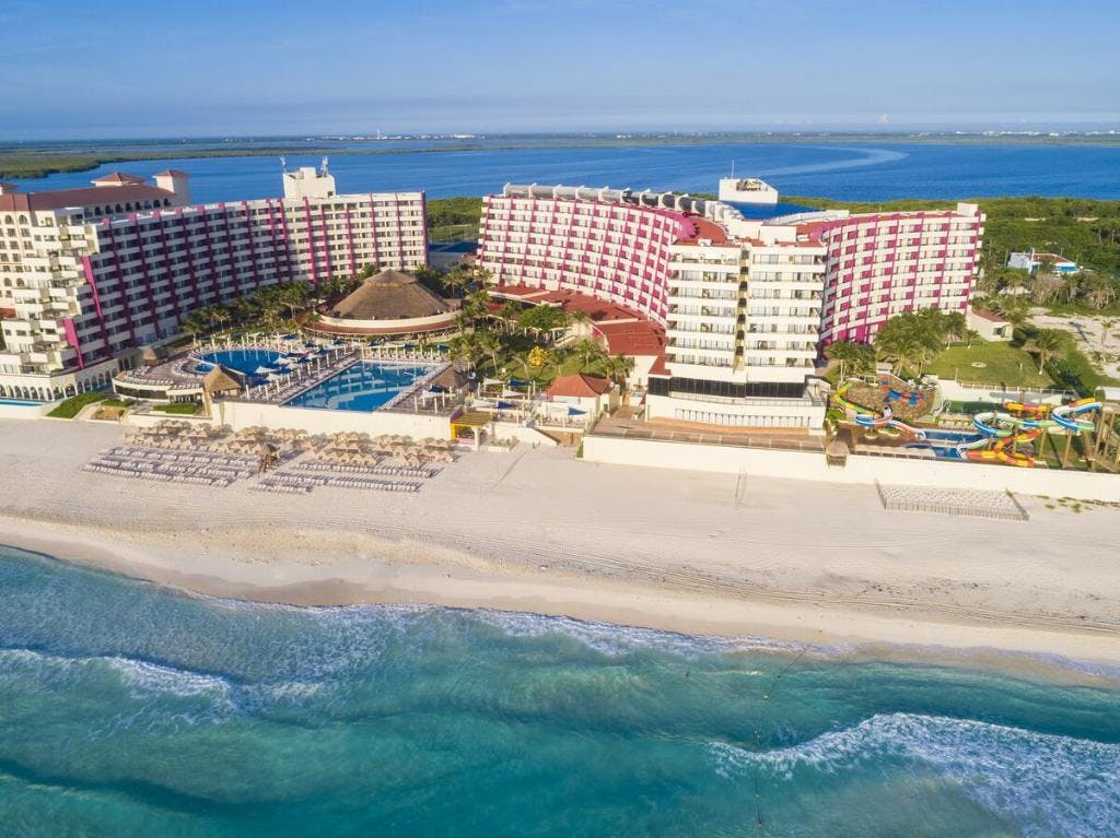 above view of crown paradise club cancun with a glance of the ocean and the beach