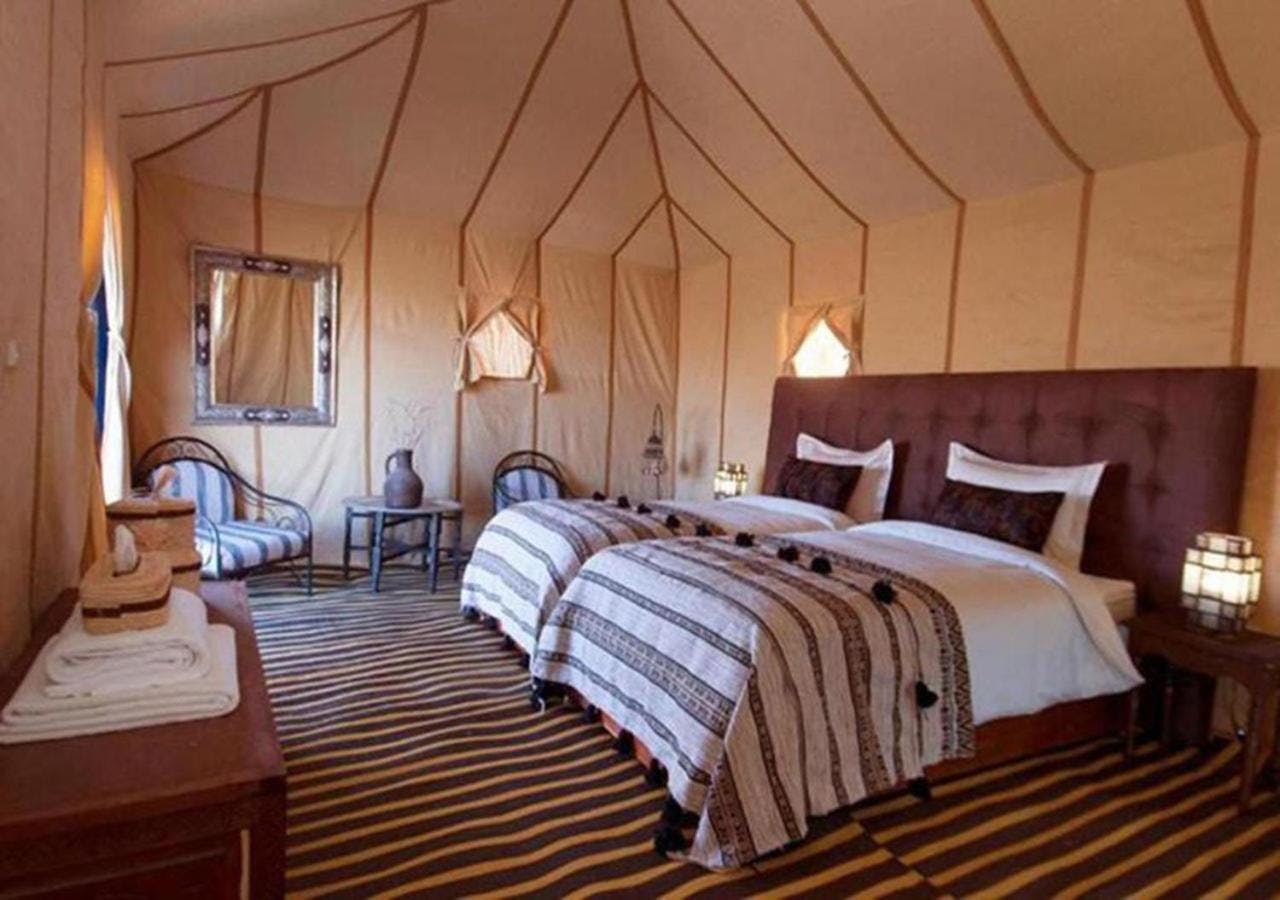interior of a tent at sahara relax camps with two one person beds