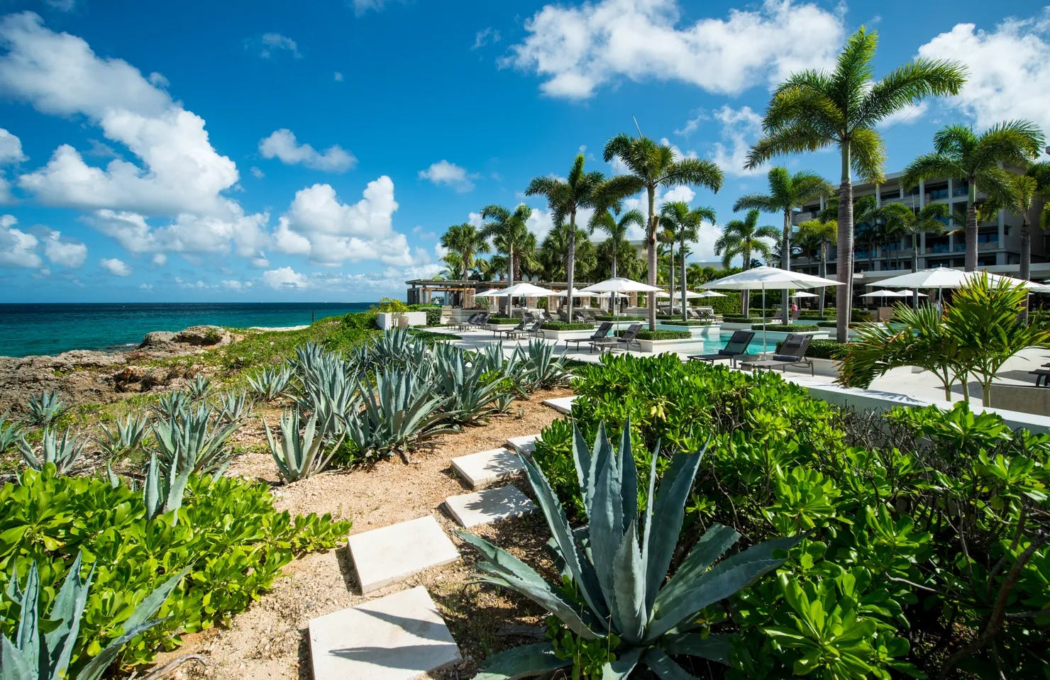 Four Season Resort pools and gardens over a cliffs with Barnes Bay view in Anguilla island, the Caribbean