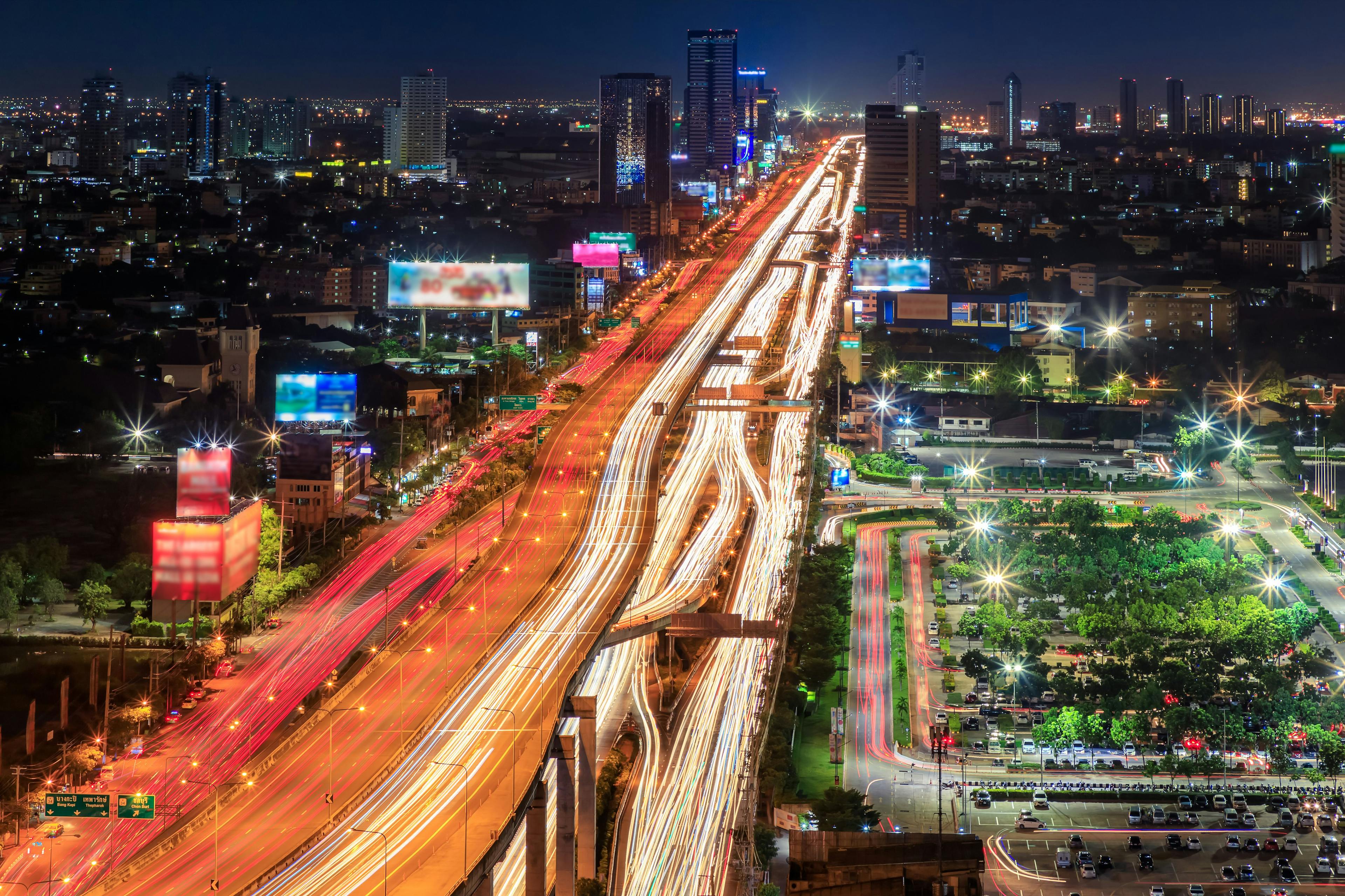Expressway arial view during night with light trail, Bang Na, Bangkok Thailand